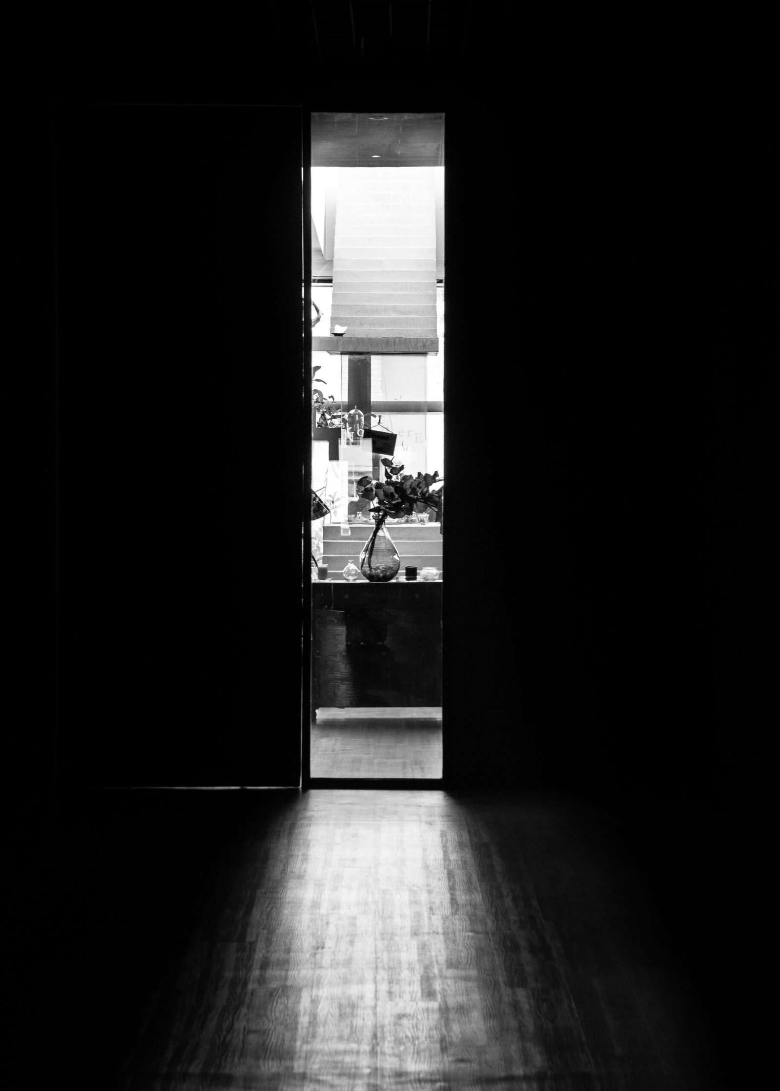 a black and white photo of an open door